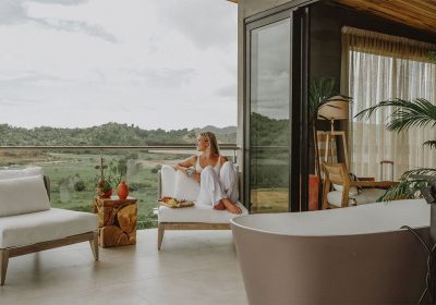 casa-cielo-villa-junior-penthouse-lady-enjoying-coffee-outdoor-patio-3